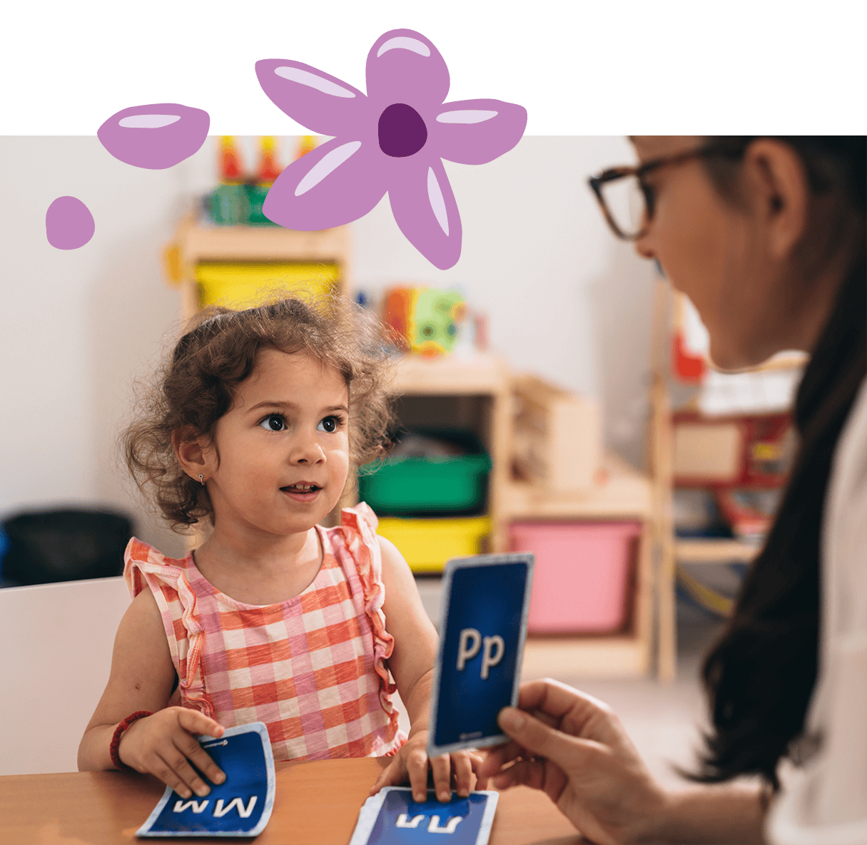 Antara Allied Health Services helps a kid learn letters and sounds with cards.